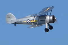 Les Crane maidens his Gloster Gladiator. Built from the Brian Taylor plan ( www.sarikhobbies.com ), model is 56” wingspan. Motor is a 4Max 360kV, 80amp ESC, prop is 17 x 10 and battery is 5s 4500. Decals from Callie Graphics depict the Shuttleworth Collection Gladiator. Flies well.  Photo Grahame Pearson.
