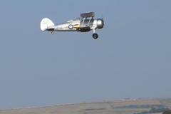 Les Crane maidens his Gloster Gladiator. Built from the Brian Taylor plan ( www.sarikhobbies.com ), model is 56” wingspan. Motor is a 4Max 360kV, 80amp ESC, prop is 17 x 10 and battery is 5s 4500. Decals from Callie Graphics depict the Shuttleworth Collection Gladiator. Flies well.  Photo Grahame Pearson.